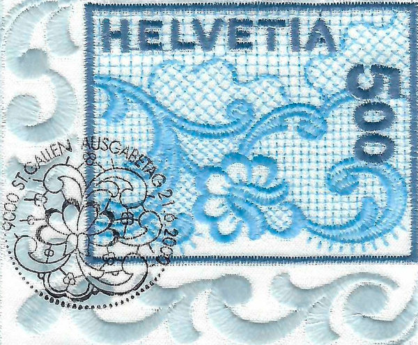 Primo francobollo in tessuto (ricamo di San Gallo)